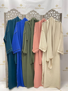 Abaya couture or dore doree matiere jazz robe de priere Abaya bande blanche lin avec poches mode modste hijab mariage abaya hijeb hijab tunique jilbeb mode modeste fashion qalam dress boutique musulmane femme voilées hijab france robe abaya blanche