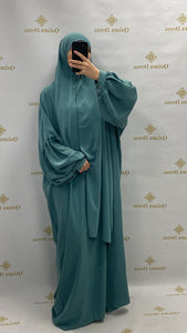 abaya ou robe de priere a enfiler tres pratique avec manches ballons tissu leger en soie de medine vert indigo tendance hijab 